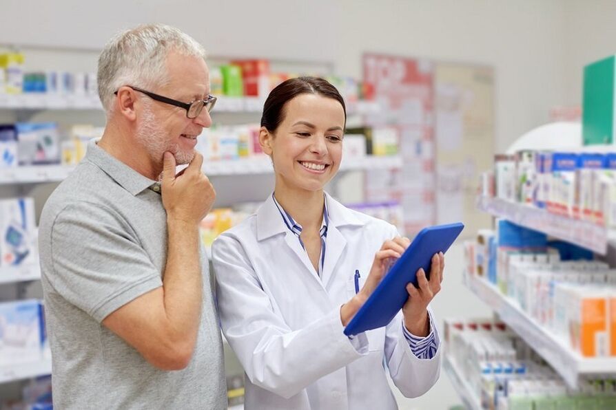A doctor prescribes medicine for parasites to a man